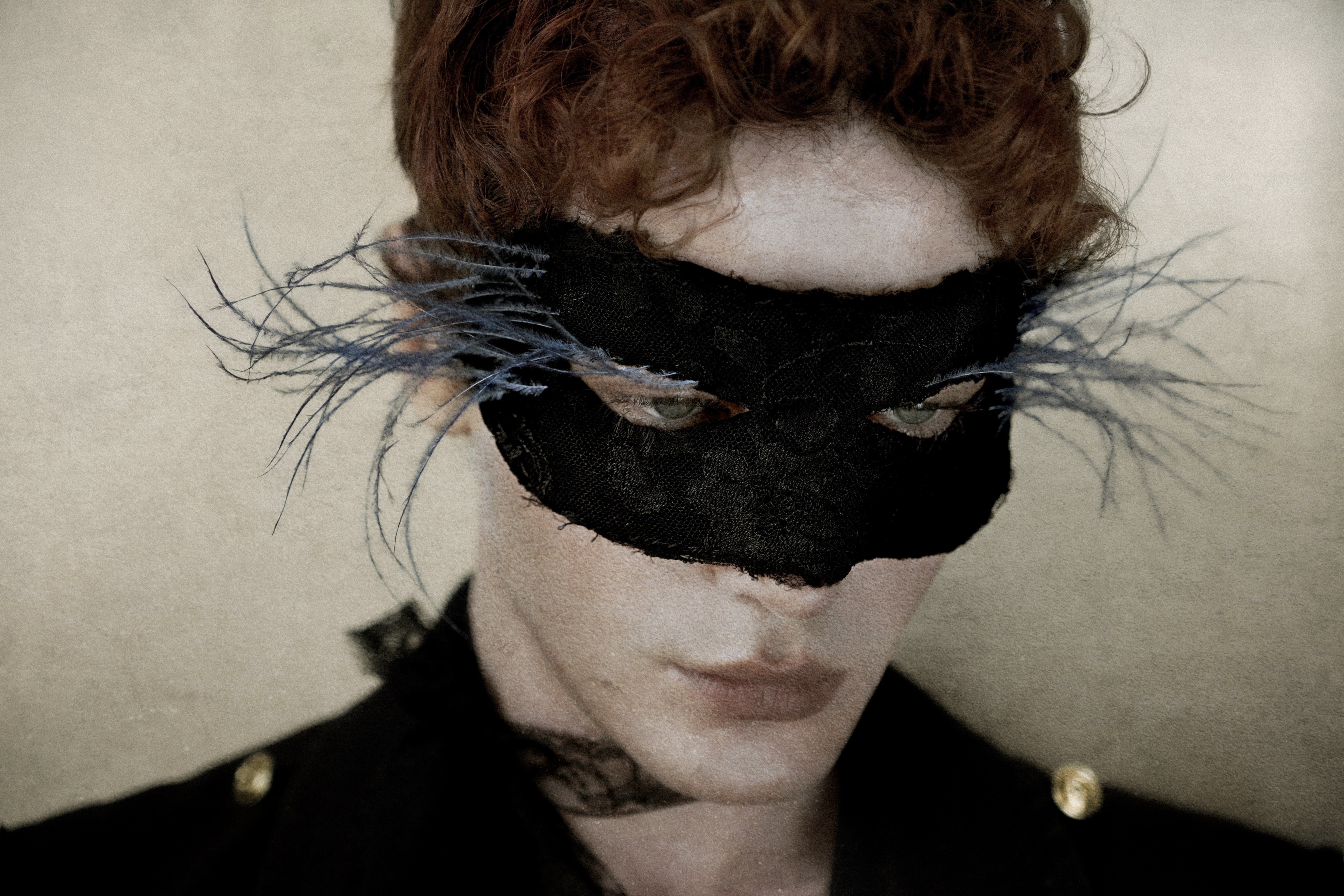 Figure in Roman's dramatic feathered mask